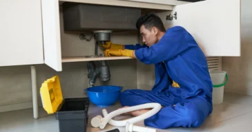 asian-plumber-blue-overalls-clearing-blockage-drain_result